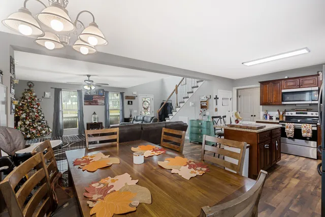 a living room with fireplace furniture and a flat screen tv