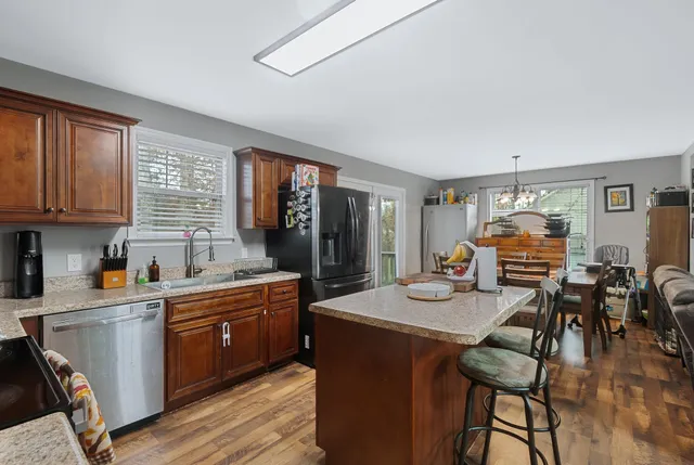 a kitchen with sink cabinets and dining table