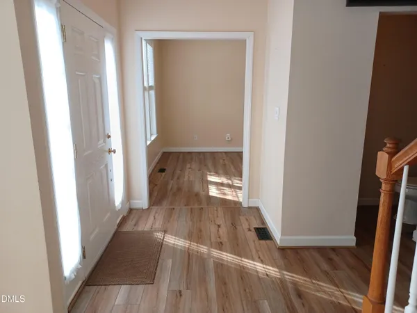 a view of entryway with wooden floor