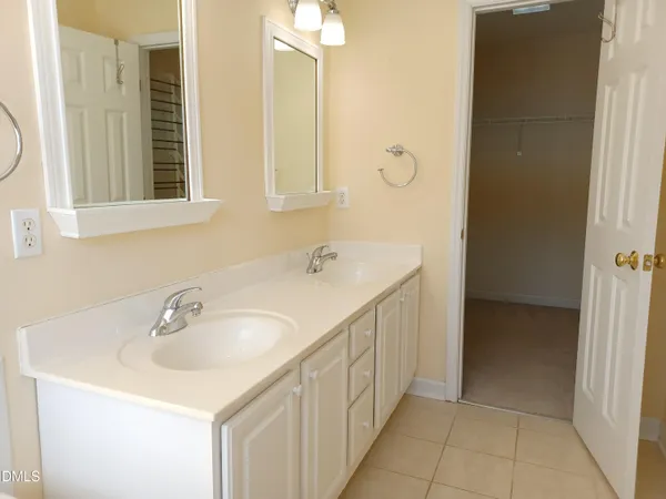 a bathroom with a tub a sink and a shower