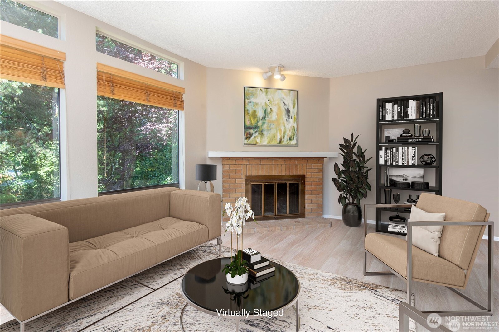 a living room with furniture a rug and a fireplace