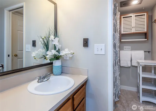 a bathroom with a sink and a mirror