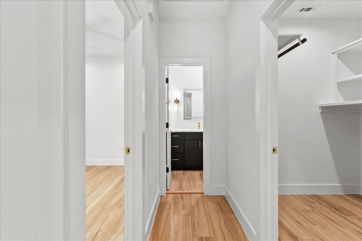 8323 Observatory Street, Unit A/B Houston, TX 77088 - Photo 36 of 38 Unit A - The thoughtfully designed second-level split floor plan offers added privacy and functionality, with the primary suite separated from the secondary bedrooms.