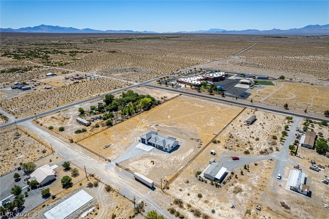 5910 East Kellogg Road Pahrump, NV 89061 - Photo 49 of 58 A desert oasis with a contemporary home, offering tranquil mountain views and ample undeveloped acreage.