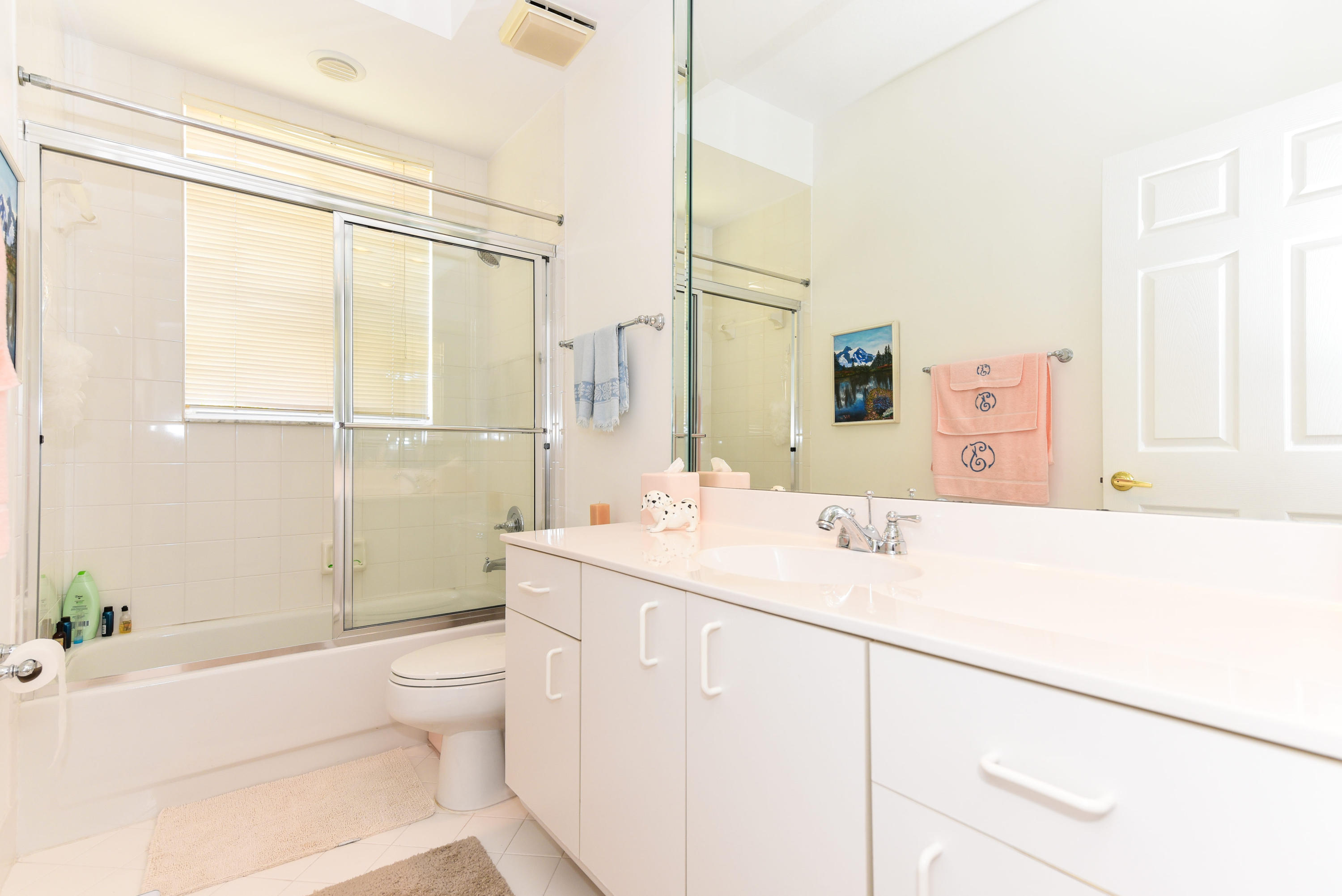 23358 Torre Circle Boca Raton, FL 33433 - Photo 16 of 34 a bathroom with a sink a toilet and shower