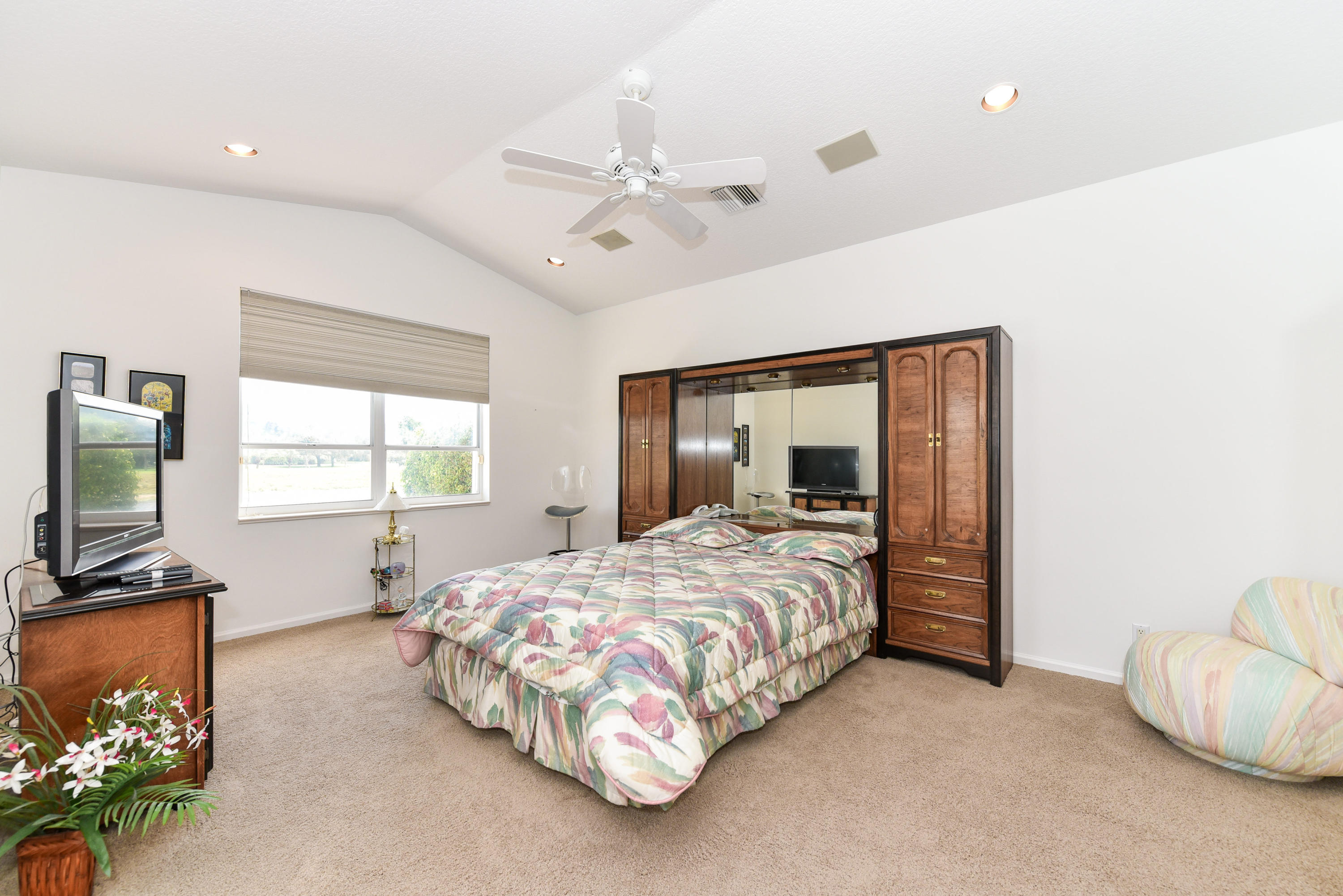 23358 Torre Circle Boca Raton, FL 33433 - Photo 20 of 34 a bedroom with a bed and a flat screen tv
