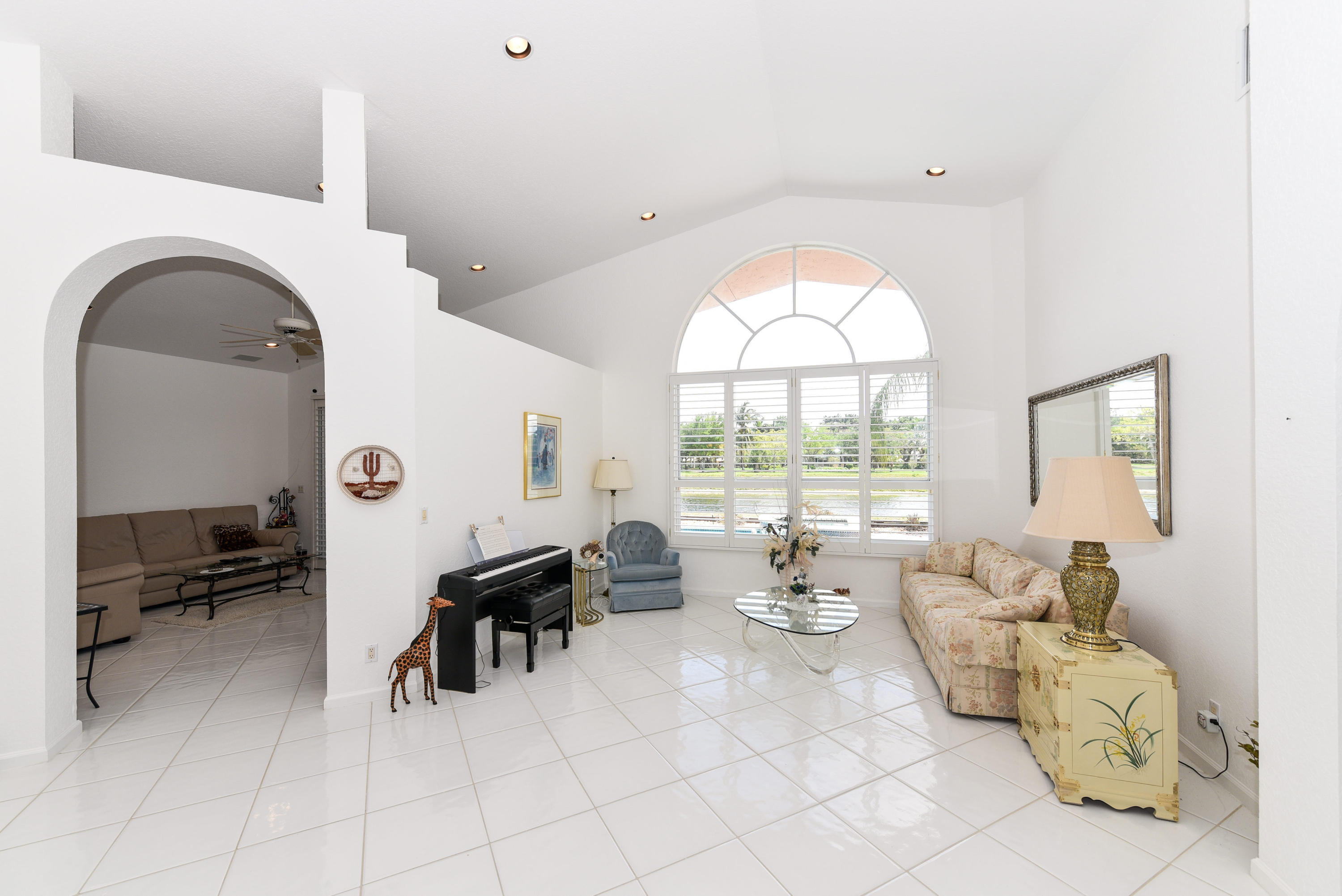 23358 Torre Circle Boca Raton, FL 33433 - Photo 5 of 34 a living room with furniture and a large window
