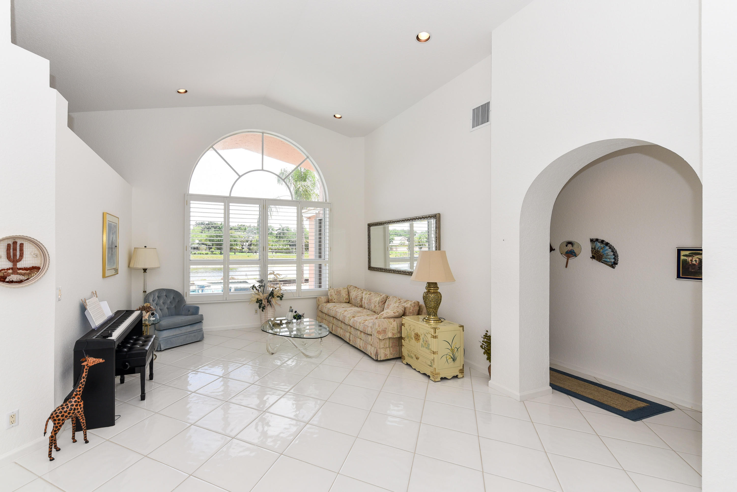 23358 Torre Circle Boca Raton, FL 33433 - Photo 6 of 34 a living room with furniture and a large window