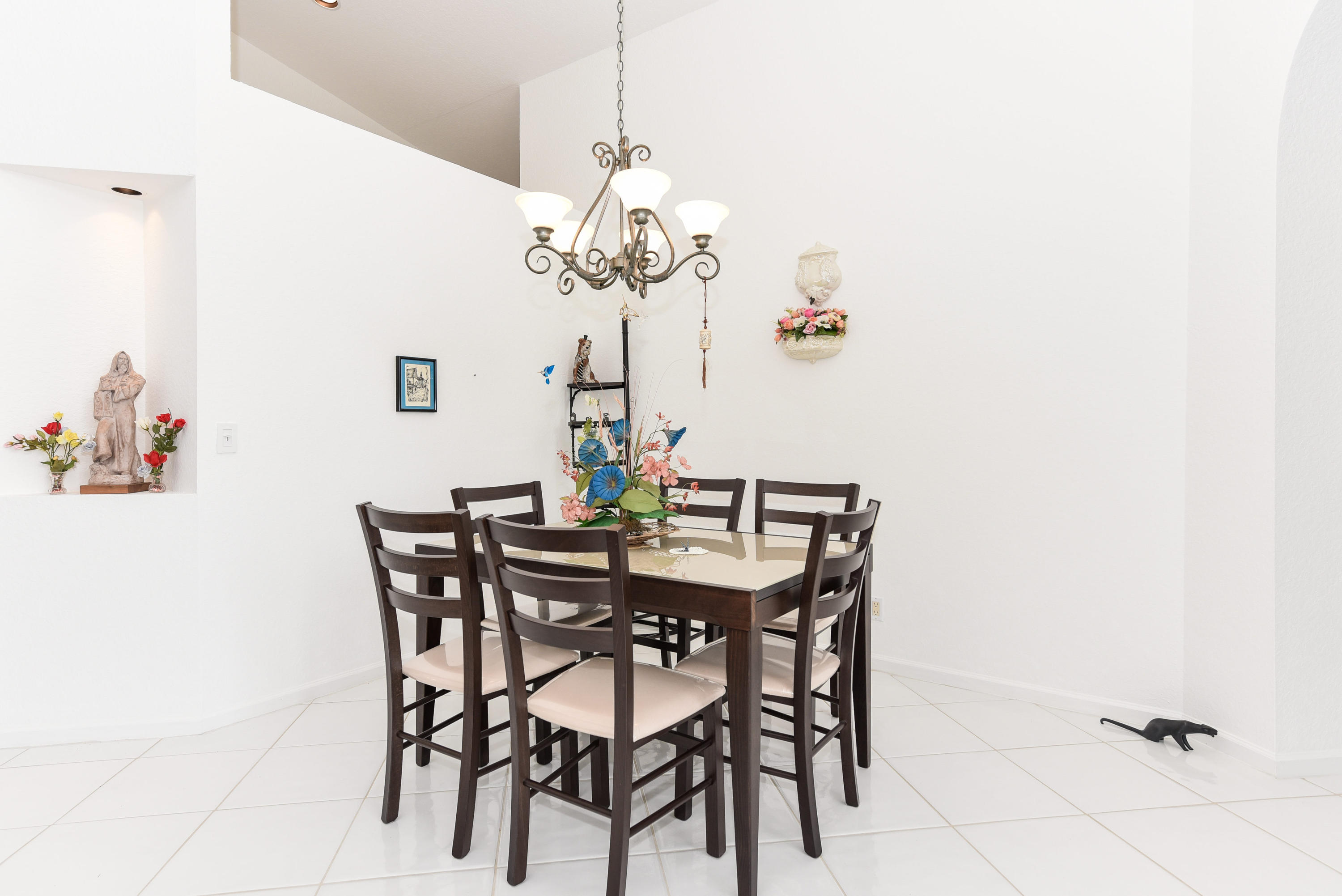 23358 Torre Circle Boca Raton, FL 33433 - Photo 8 of 34 a view of a dining room with furniture and chandelier