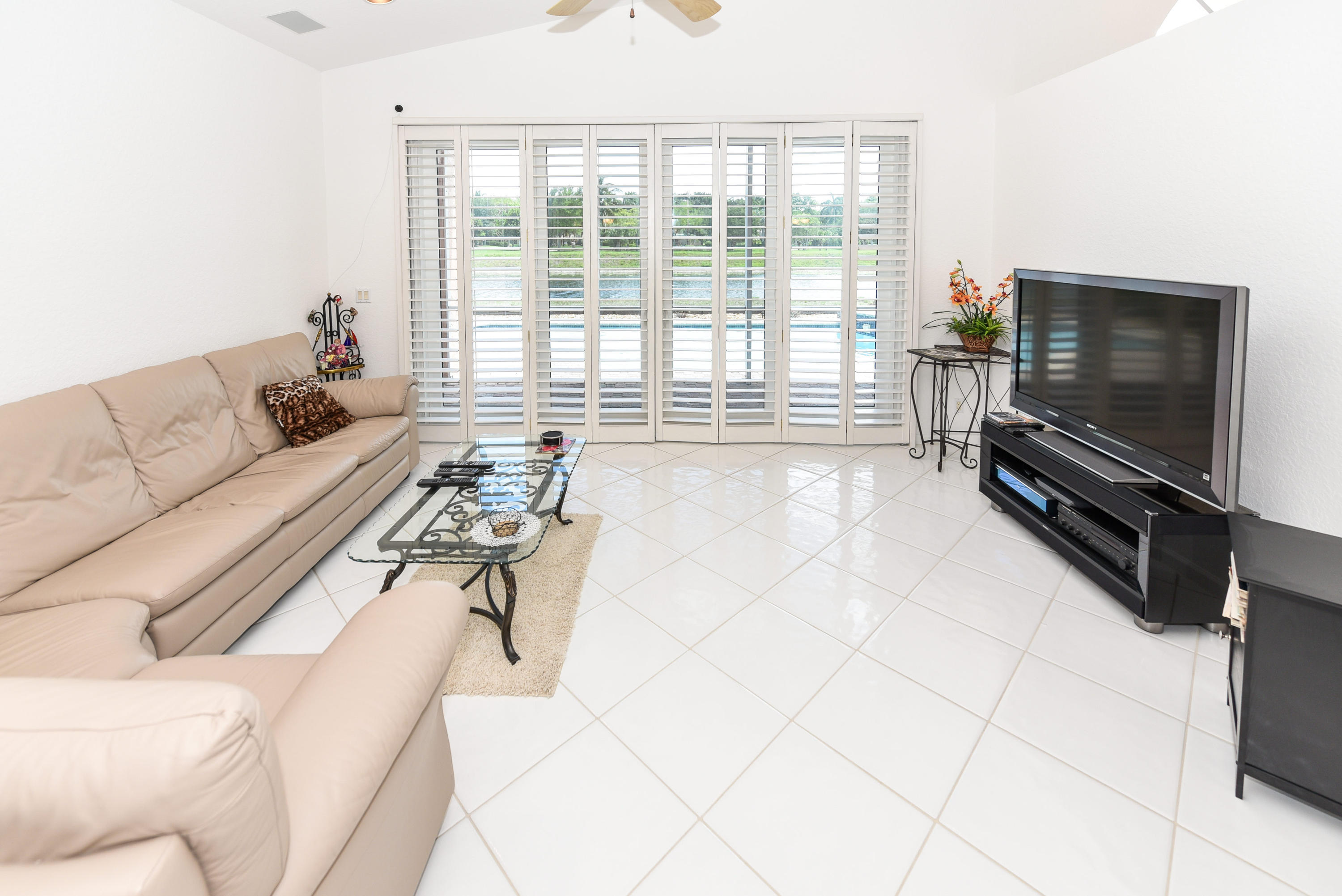 23358 Torre Circle Boca Raton, FL 33433 - Photo 10 of 34 a living room with furniture and a flat screen tv