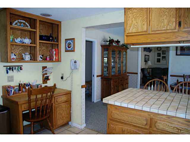 520 Amigos Road Ramona, CA 92065 - Photo 4 of 17 Another view of kitchen showing built-in desk & bookcase.