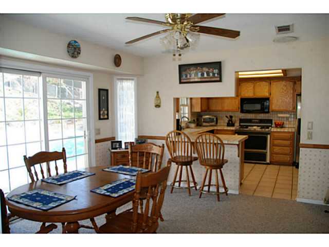 520 Amigos Road Ramona, CA 92065 - Photo 5 of 17 View of DR looking toward kitchen. Sliding glass door leads to Pool, Spa & Patio.
