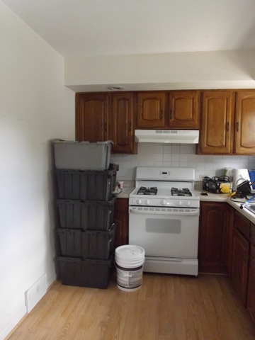 2411 West Cheyenne Road Waukegan, IL 60087 - Photo 13 of 18 a kitchen with a stove and a refrigerator