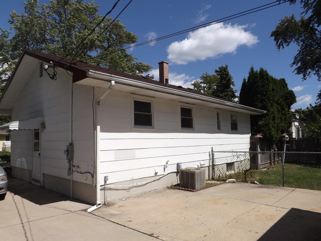 2411 West Cheyenne Road Waukegan, IL 60087 - Photo 3 of 18 a view of a house with a yard