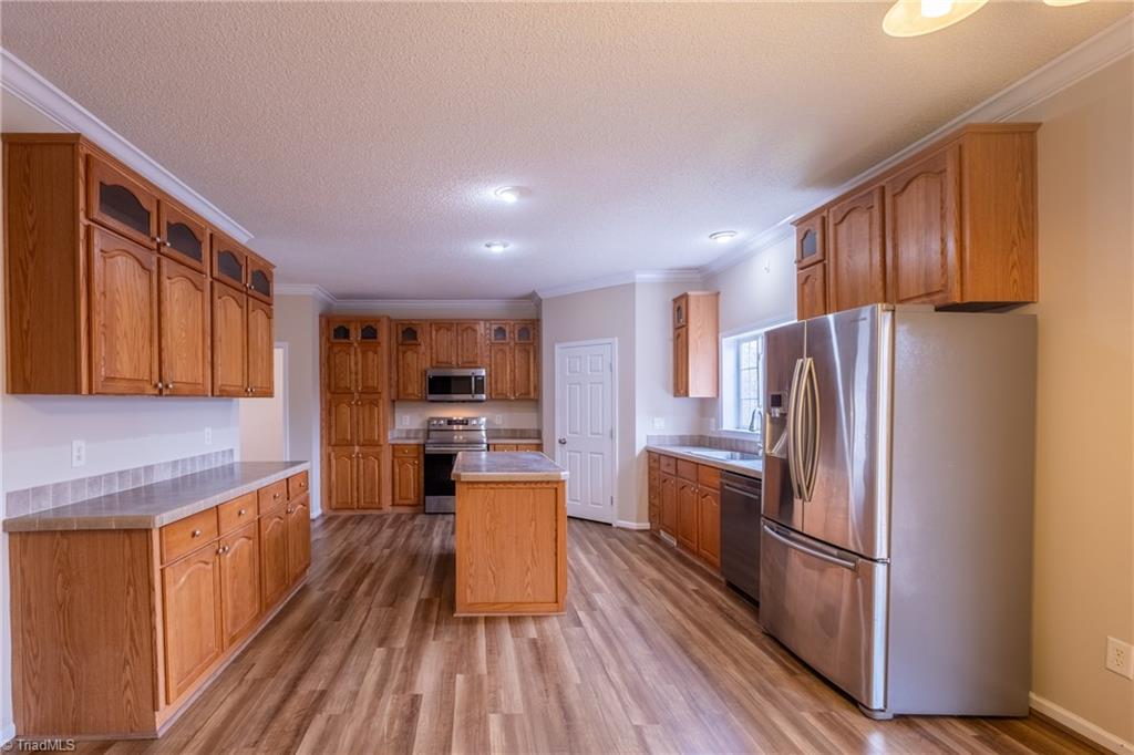 485 Amos Road Madison, NC 27025 - Photo 11 of 37 Kitchen full compliment of appliances and storage including pantry