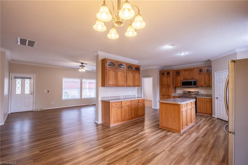 485 Amos Road Madison, NC 27025 - Photo 12 of 37 Transitional great room, kitchen and dining