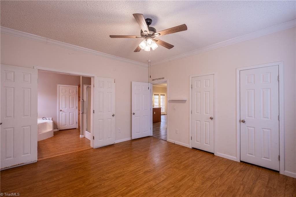 485 Amos Road Madison, NC 27025 - Photo 17 of 37 Primary bedroom, 2 closets, en suite bath with walk in closet