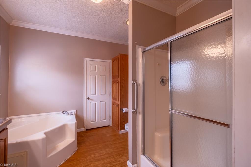 485 Amos Road Madison, NC 27025 - Photo 20 of 37 Primary bath, double vanity, garden tub and separate shower