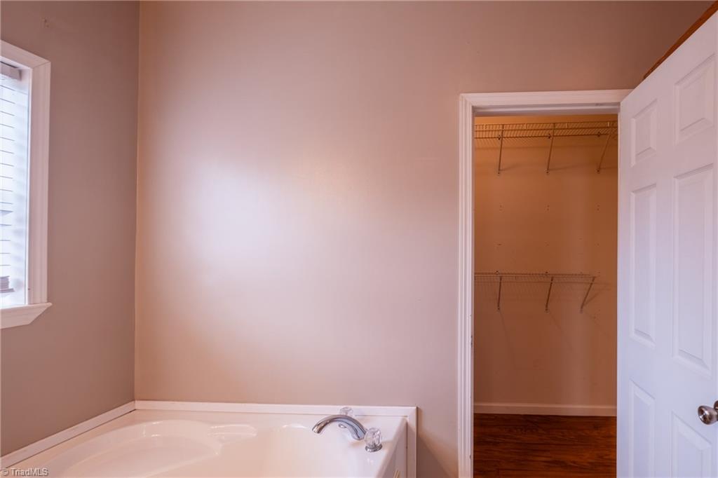 485 Amos Road Madison, NC 27025 - Photo 21 of 37 Primary bedroom, en suite bath and walk in closet