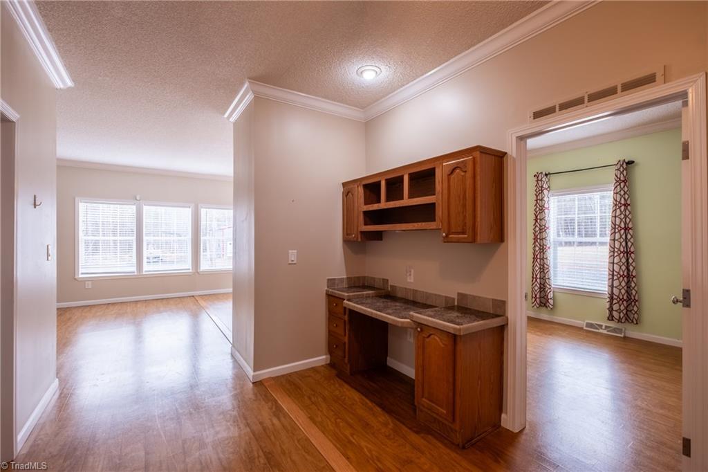 485 Amos Road Madison, NC 27025 - Photo 24 of 37 Work desk in hallway to great room