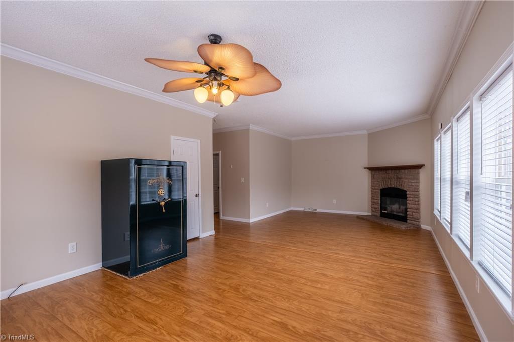 485 Amos Road Madison, NC 27025 - Photo 30 of 37 Great room with view of fireplace