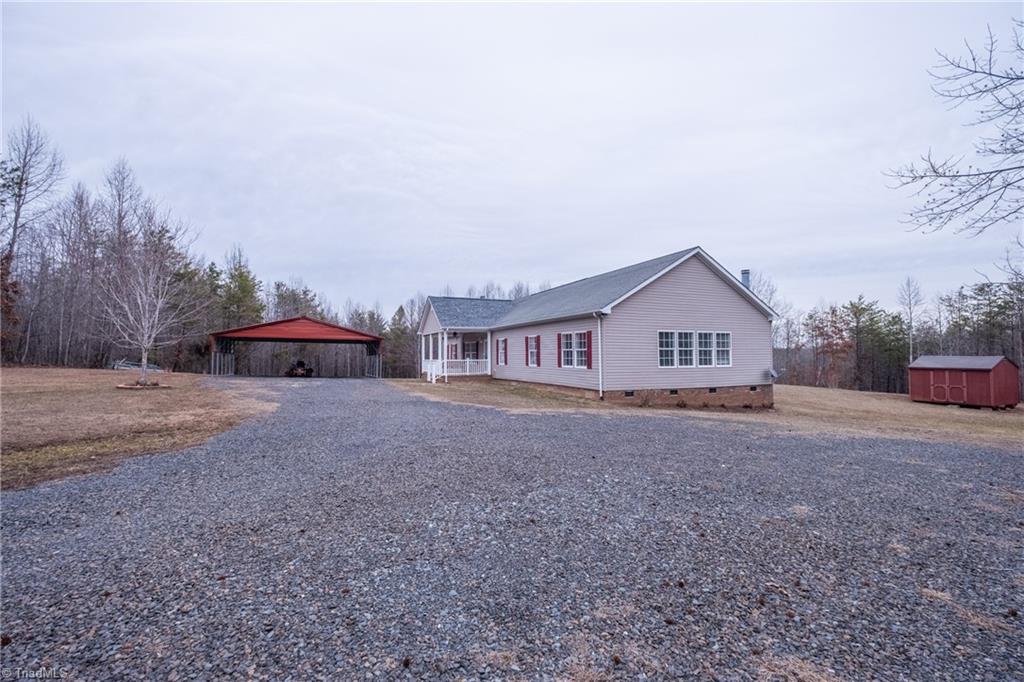 485 Amos Road Madison, NC 27025 - Photo 3 of 37 View from driveway approaching home