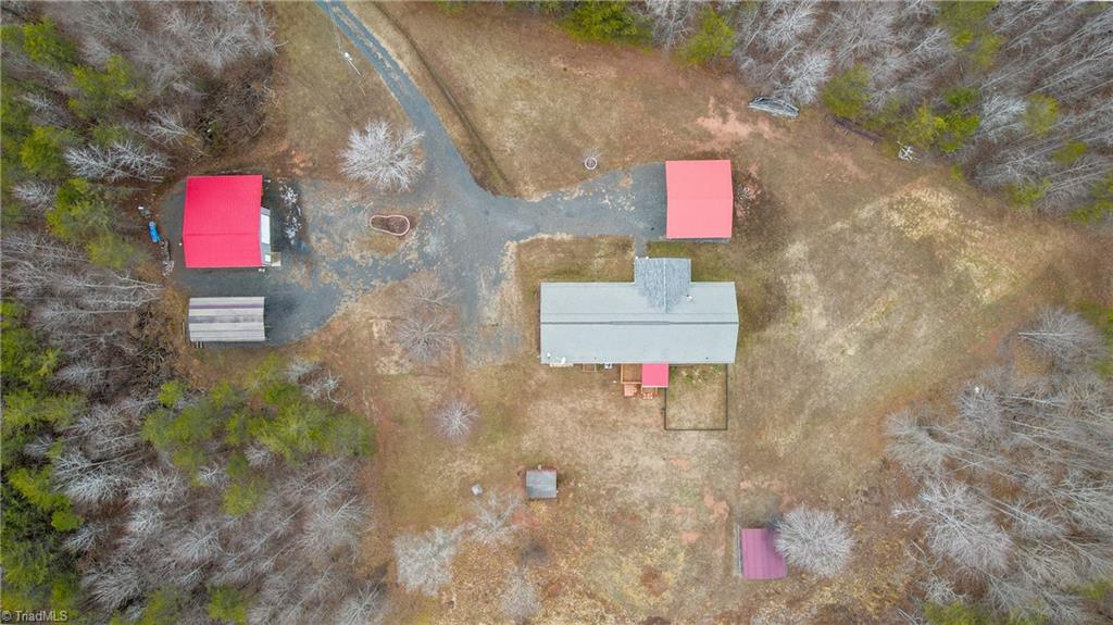 485 Amos Road Madison, NC 27025 - Photo 4 of 37 Aerial view of home, strorage shed, workshop and covered parking areas