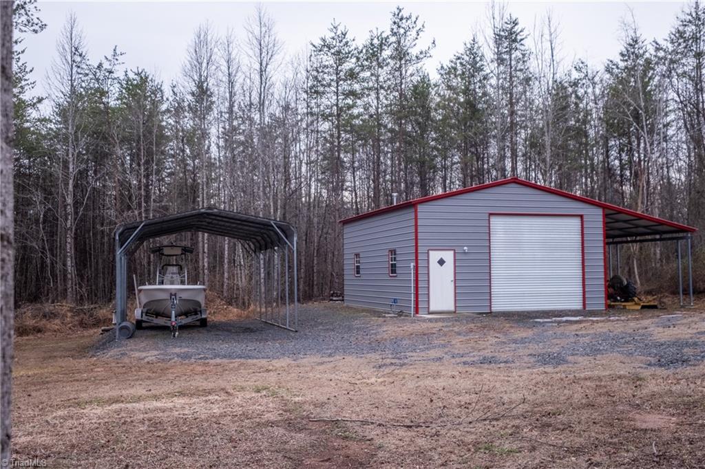 485 Amos Road Madison, NC 27025 - Photo 5 of 37 Covered storage and workshop with additional covered storage