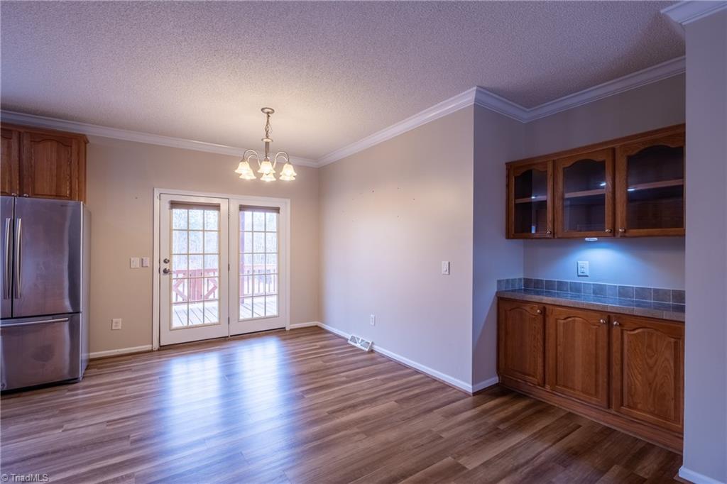 485 Amos Road Madison, NC 27025 - Photo 9 of 37 Dining room with exit onto covered porch and deck