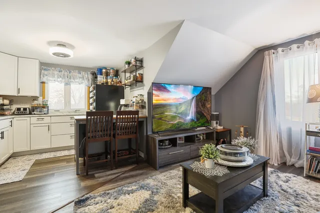 a kitchen with a table and chairs in it