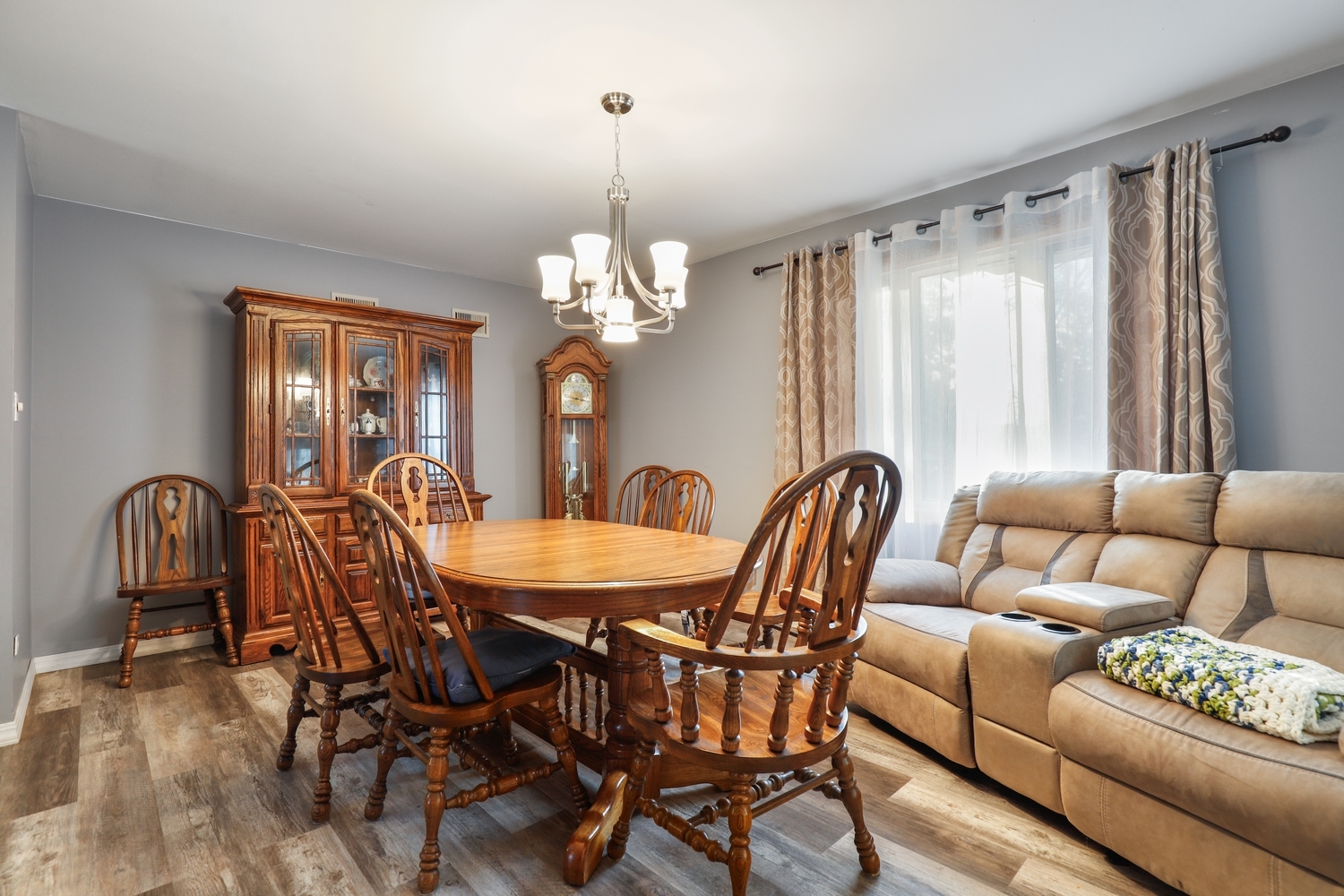 11S450 Carpenter Street Lemont, IL 60439 - Photo 5 of 29 a dining room with furniture a chandelier and wooden floor
