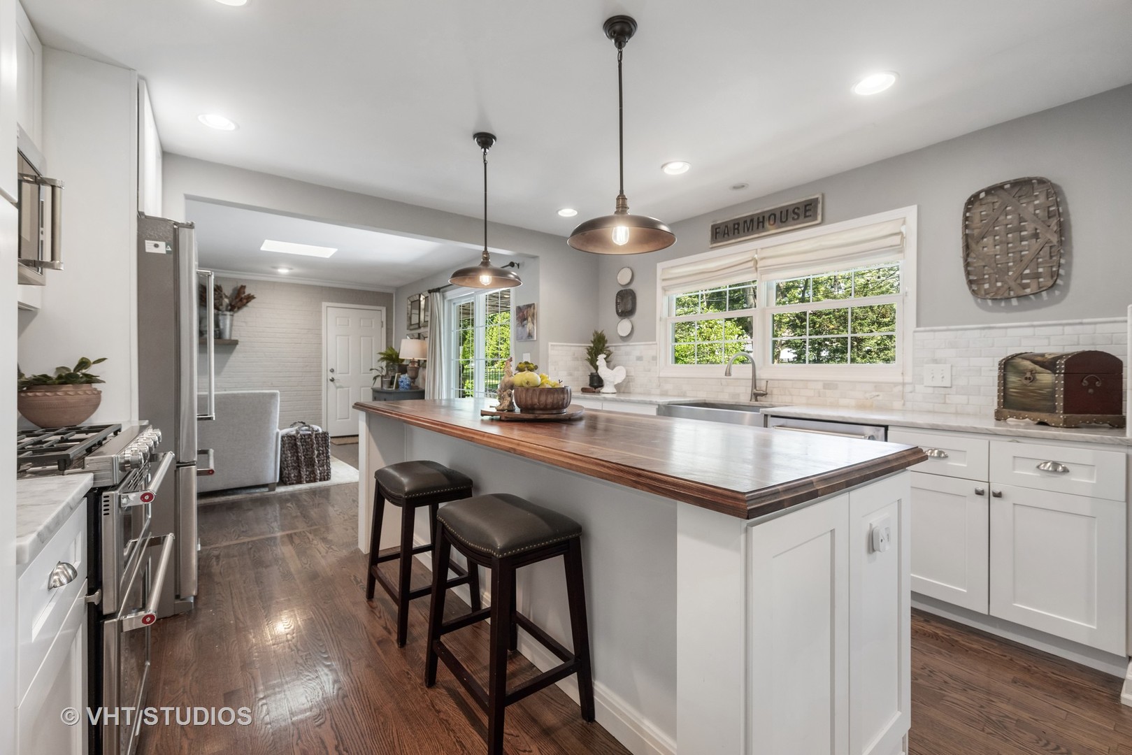 1305 Gamon Road Wheaton, IL 60189 - Photo 14 of 30 a kitchen with stainless steel appliances granite countertop counter space a sink refrigerator and cabinets