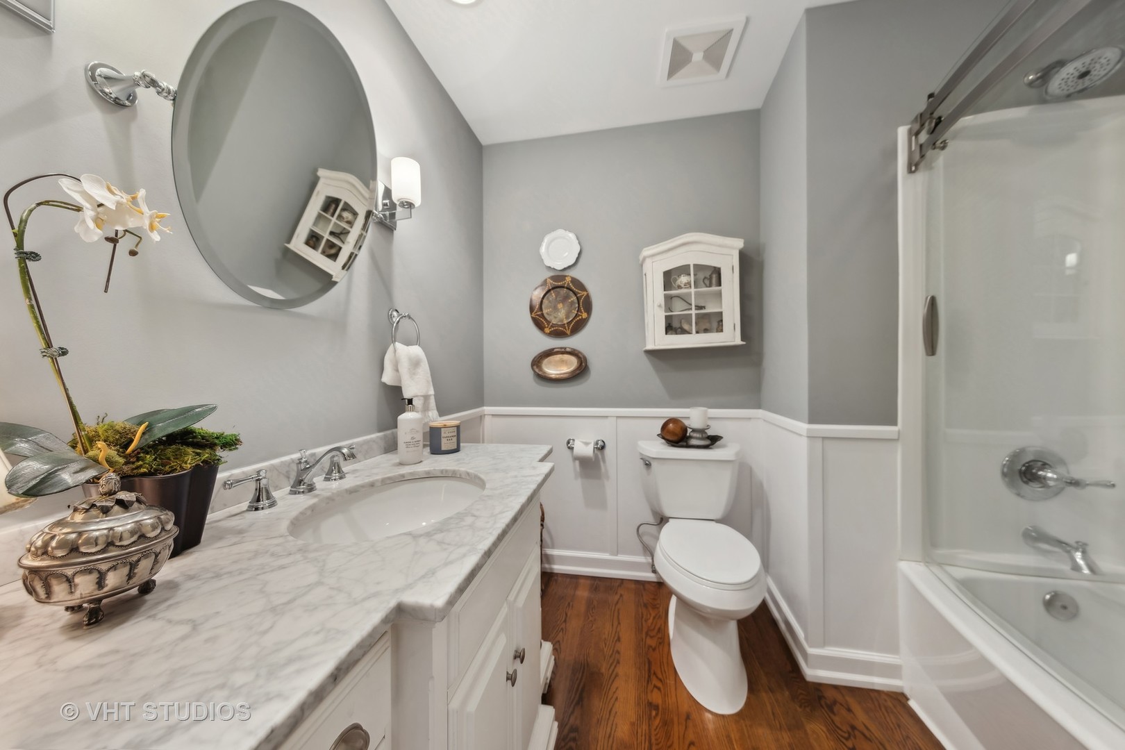 1305 Gamon Road Wheaton, IL 60189 - Photo 19 of 30 a bathroom with a sink a toilet and shower