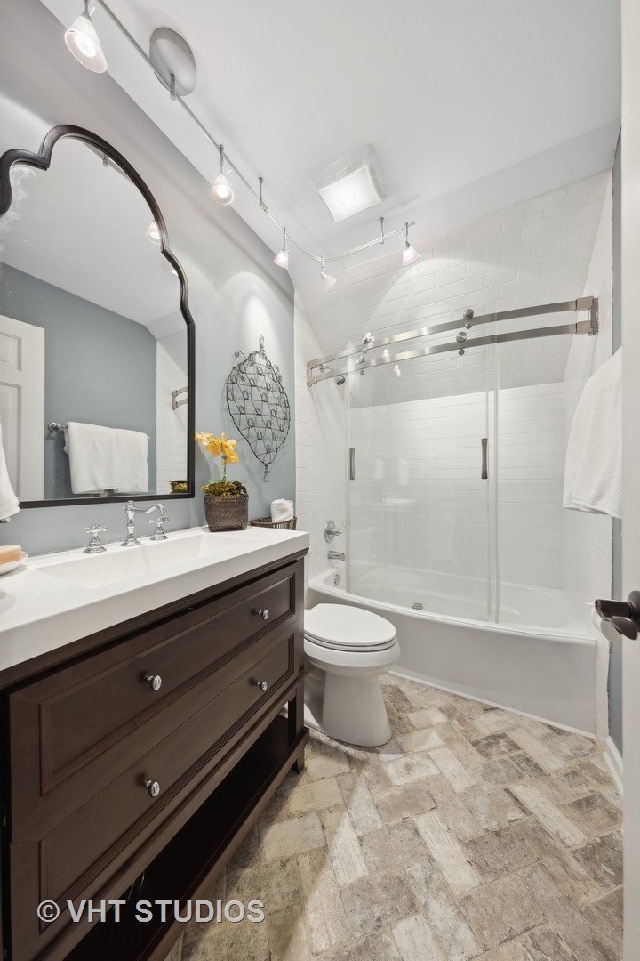 1305 Gamon Road Wheaton, IL 60189 - Photo 22 of 30 a bathroom with a granite countertop sink mirror vanity and toilet