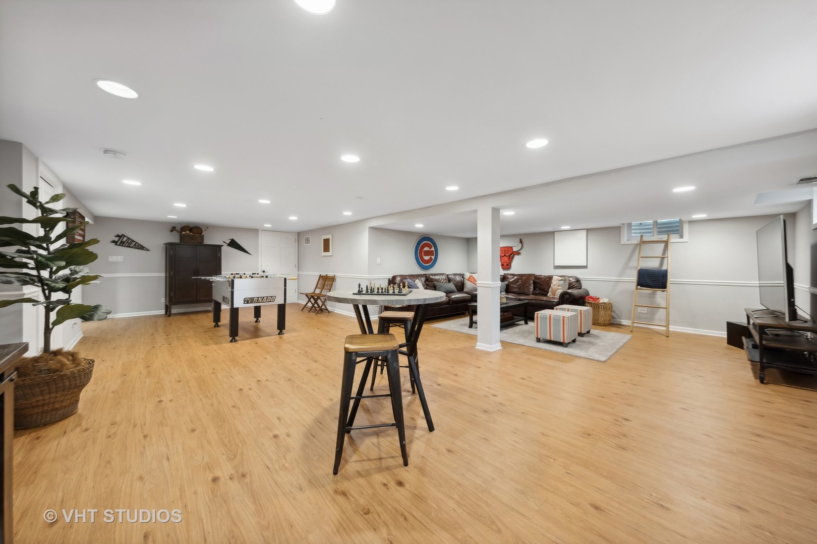 1305 Gamon Road Wheaton, IL 60189 - Photo 26 of 30 a living room with furniture a table tennis table and a flat screen tv