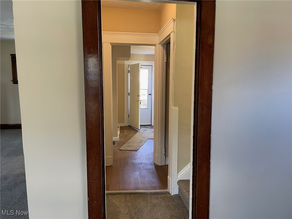 494 Eddy Road Cleveland, OH 44108 - Photo 21 of 47 Hallway view from the living room looking towards the kitchen and back door