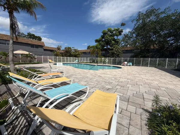 a view of a backyard with a patio