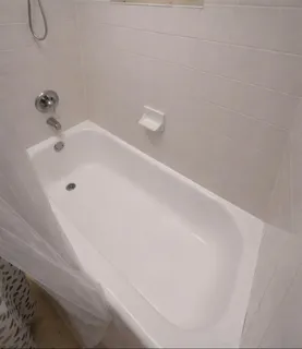 a bathroom with a white bath tub