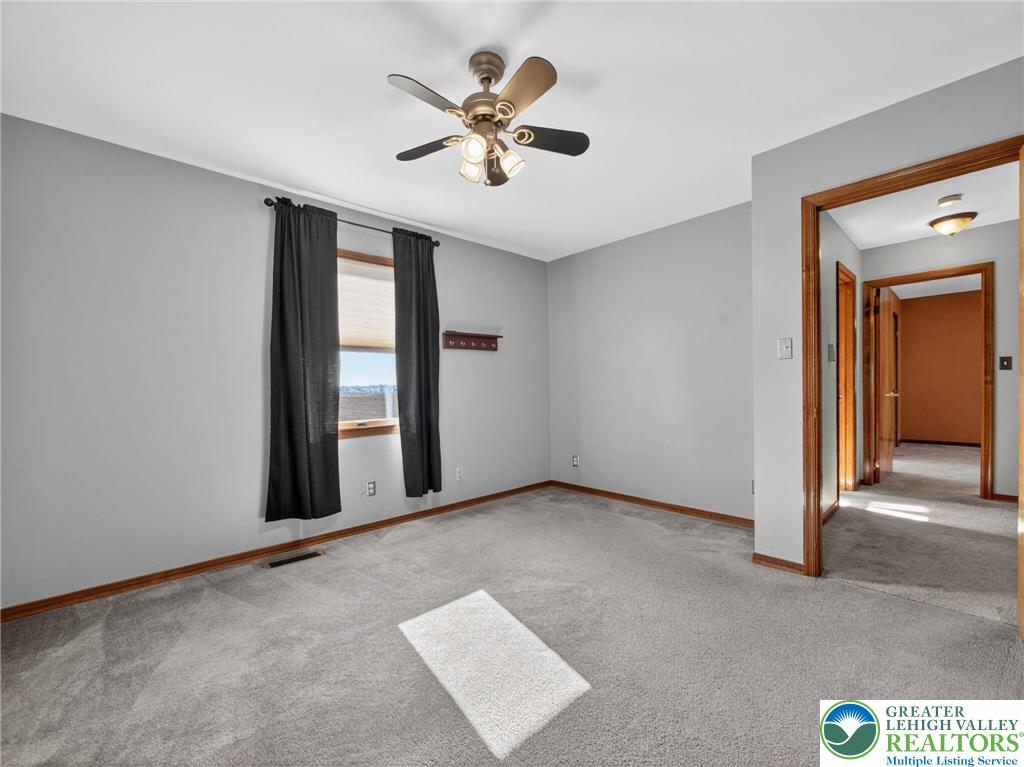7098 Limerick Square Bath, PA 18014 - Photo 20 of 31 an empty room with windows and ceiling fan