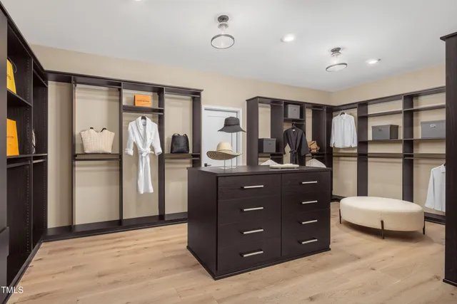 a living room with a couch and a dresser