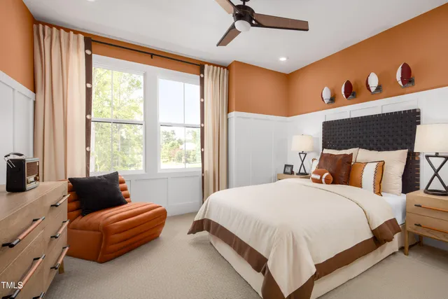 a bedroom with a bed couch and window