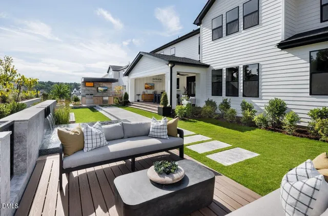 a view of a patio with couches table and chairs