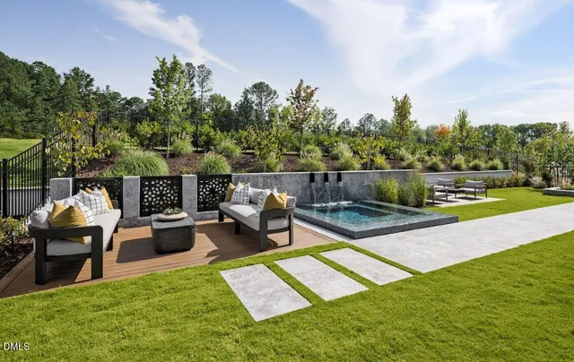 a view of a backyard with sitting area