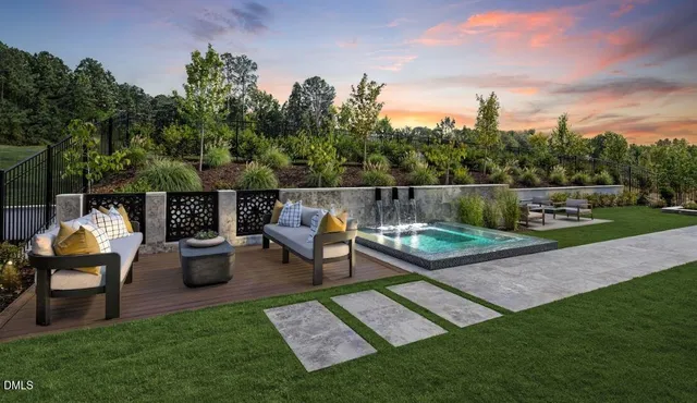 a view of a backyard with sitting area