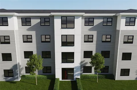 a view of an apartment with a garden