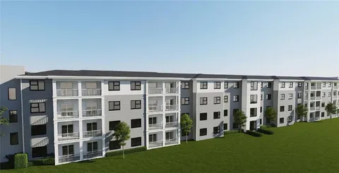 a front view of a house with parking space