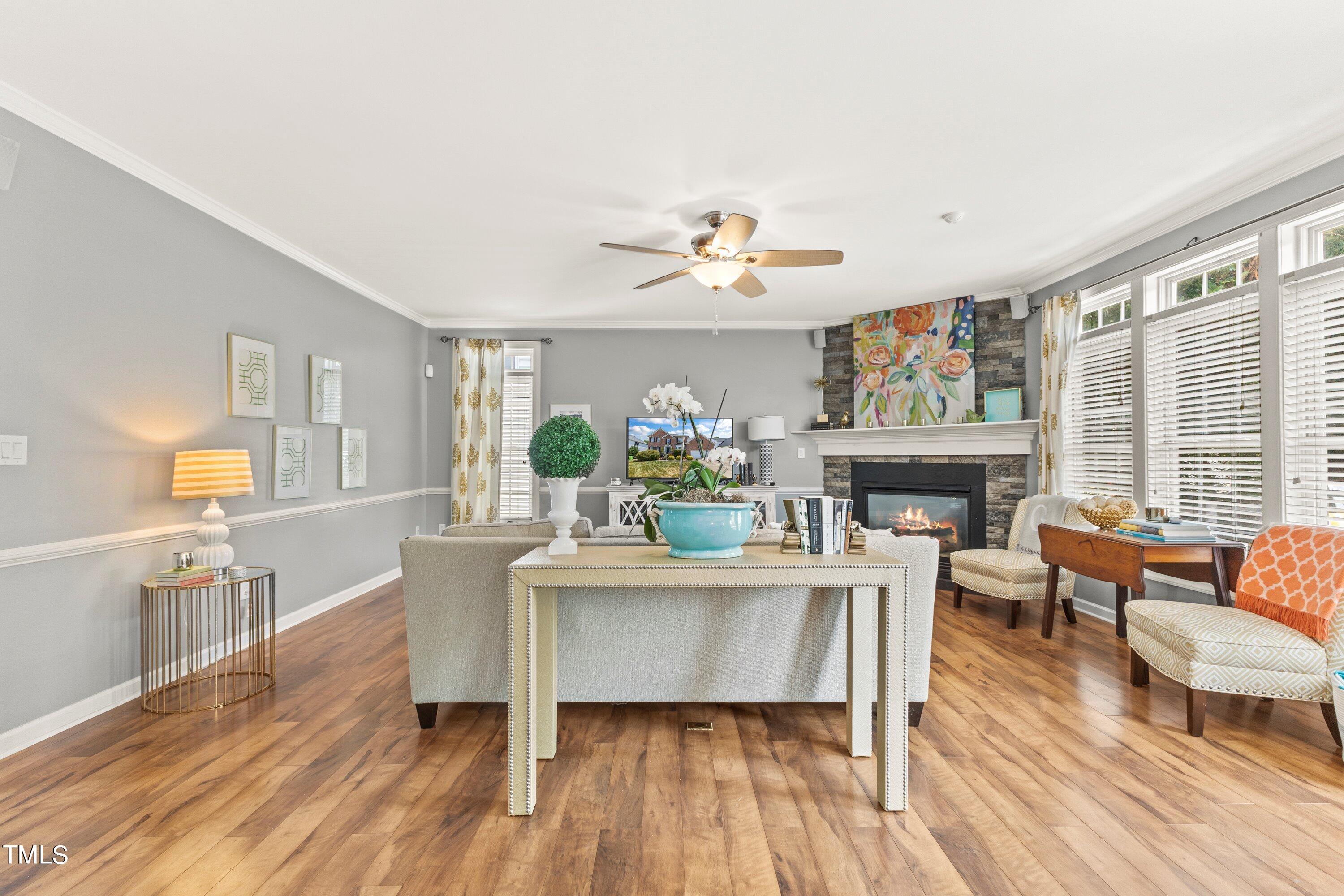 12212 Penrose Trail Raleigh, NC 27614 - Photo 12 of 41 a living room with fireplace furniture and a wooden floor