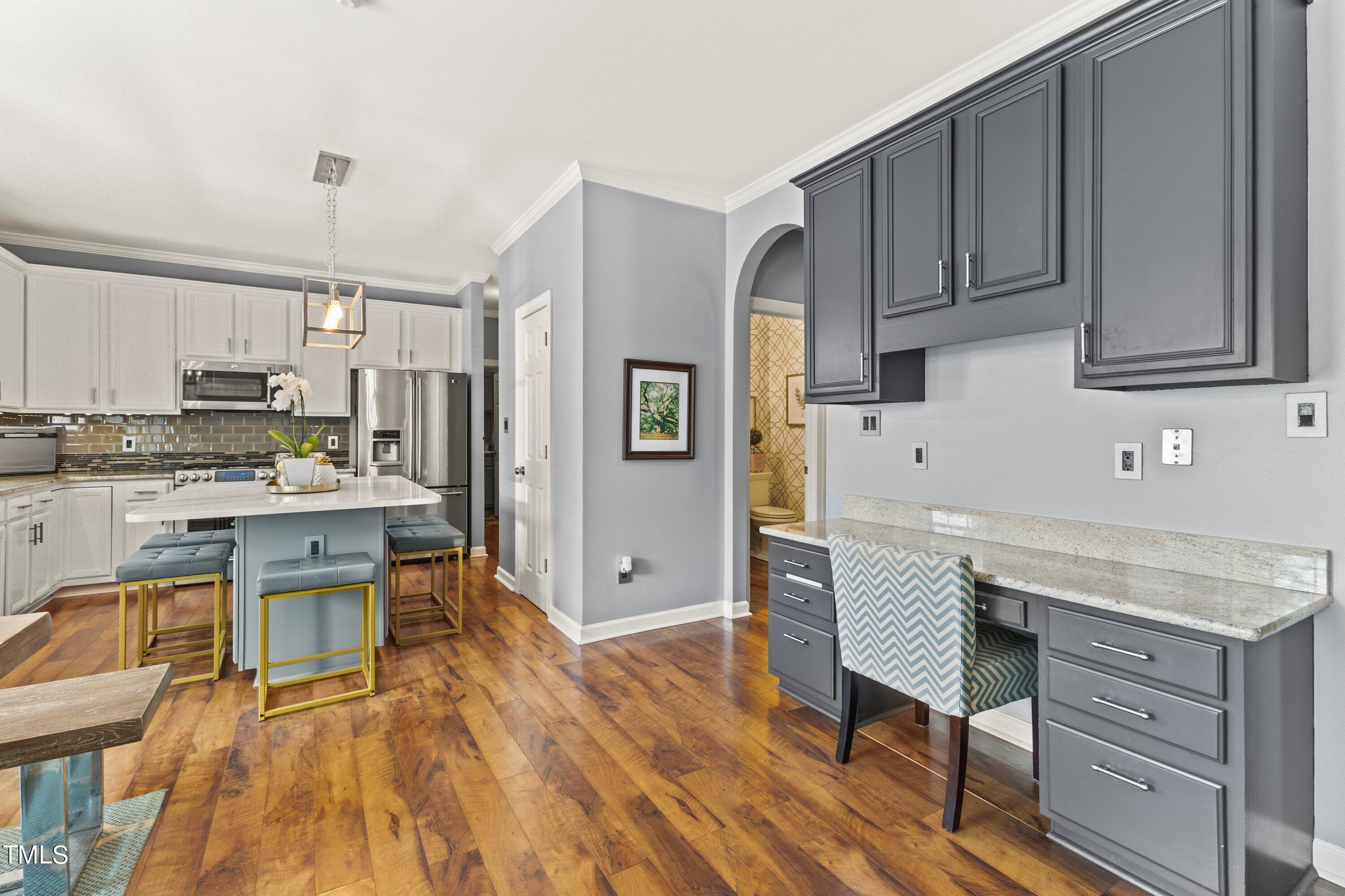 12212 Penrose Trail Raleigh, NC 27614 - Photo 14 of 41 a kitchen with stainless steel appliances granite countertop a stove refrigerator sink and cabinets