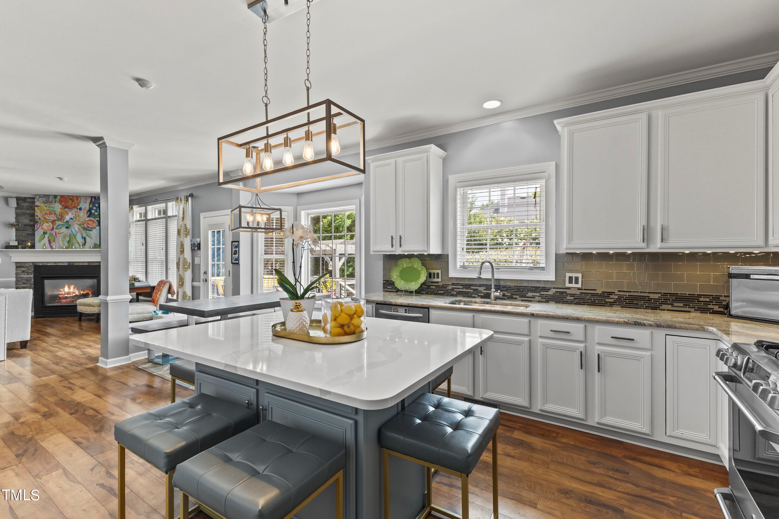 12212 Penrose Trail Raleigh, NC 27614 - Photo 17 of 41 a view of a kitchen center island and windows