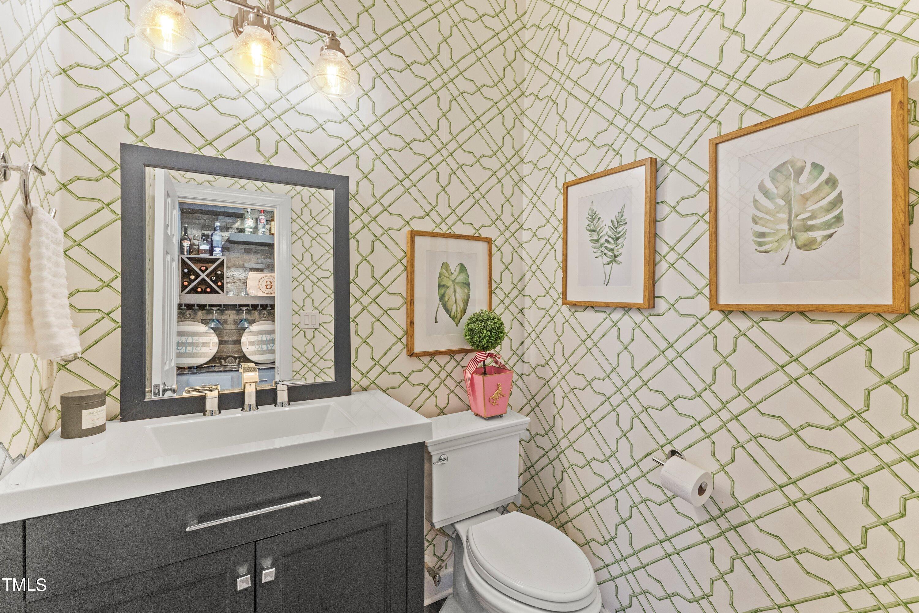 12212 Penrose Trail Raleigh, NC 27614 - Photo 21 of 41 a bathroom with a sink a toilet and shower curtain